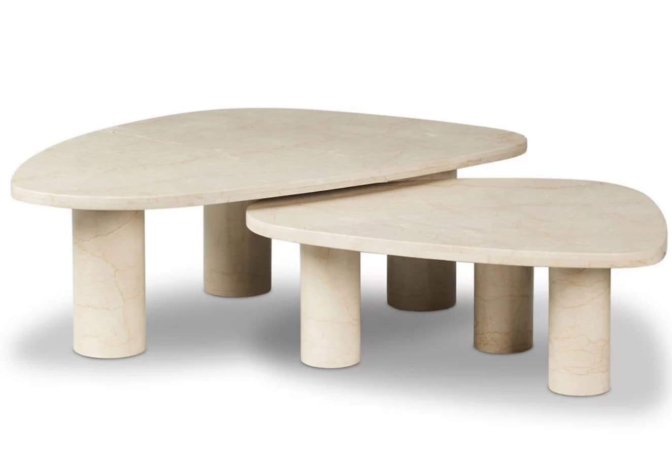 A set of two nesting coffee tables crafted from light-colored travertine, featuring irregular, organically shaped tabletops and sturdy cylindrical legs. — 3D model