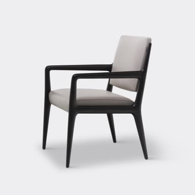 A contemporary armchair with a dark wooden frame and light-colored upholstered seat and backrest, featuring clean lines and integrated armrests. — 3D model