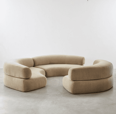 A large, modular sectional sofa with multiple curved sections, upholstered in a light beige velvet fabric, designed for flexible arrangement in a contemporary setting. — 3D model