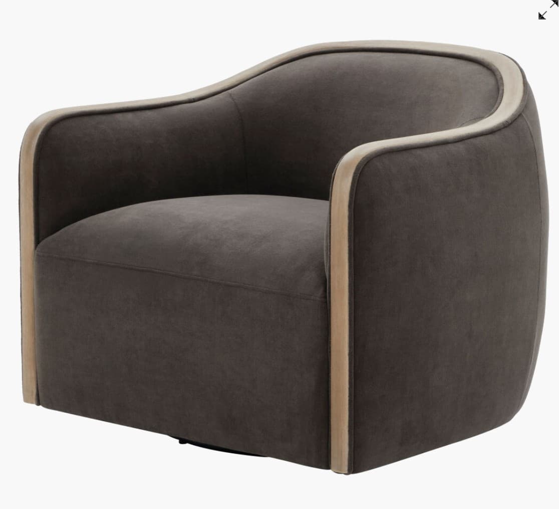 A modern upholstered swivel armchair featuring a dark gray fabric over a curved back and arms. The chair is distinguished by a continuous exposed light-toned wooden frame that outlines the top edge of the back and runs down the outer sides of the armrests. The seat cushion is integrated, and the chair sits on a discrete swivel base, visible beneath the upholstered body. — 3D model