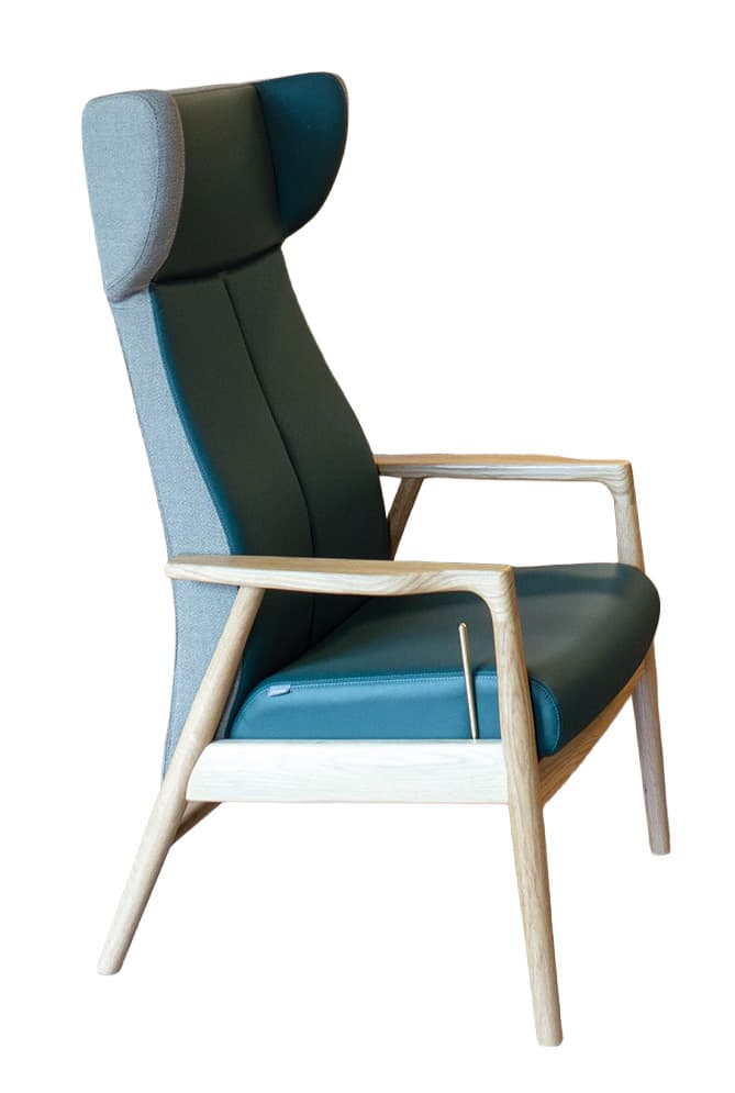 A high-backed armchair with a distinct wingback design, featuring a combination of upholstery materials and a wooden frame. The seat and backrest are upholstered in a smooth, dark teal material, likely leather or a high-quality synthetic. The sides and rear of the backrest are upholstered in a textured, light grey fabric. The frame, including the legs, armrests, and structural supports, is constructed from light-colored wood with a natural finish, showcasing visible grain. The design is contemporary with clean lines and ergonomic curves. — 3D model