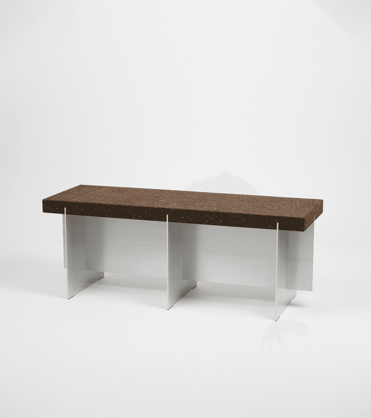 A rectangular bench with a textured, dark brown top and a sleek, silver-toned base. The top appears to be made of a composite material with visible granular texture. The base consists of multiple vertically oriented panels that interlock or are joined to form a stable structure. The design is modern and minimalist. — 3D model