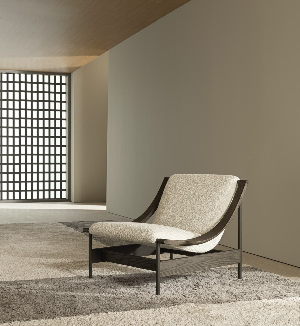 A contemporary lounge chair featuring a dark-stained solid wood frame with distinct curved armrests that flow into the backrest supports. The seat and back are upholstered with thick, textured, off-white bouclé fabric cushions, providing a comfortable and inviting aesthetic. The frame has a low-slung profile, emphasizing relaxation. — 3D model
