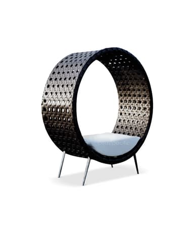A circular lounge chair featuring a dark, tightly woven synthetic rattan frame, supported by four slender metallic legs. It includes a fitted white cushion for seating within its open, ring-like structure. — 3D model