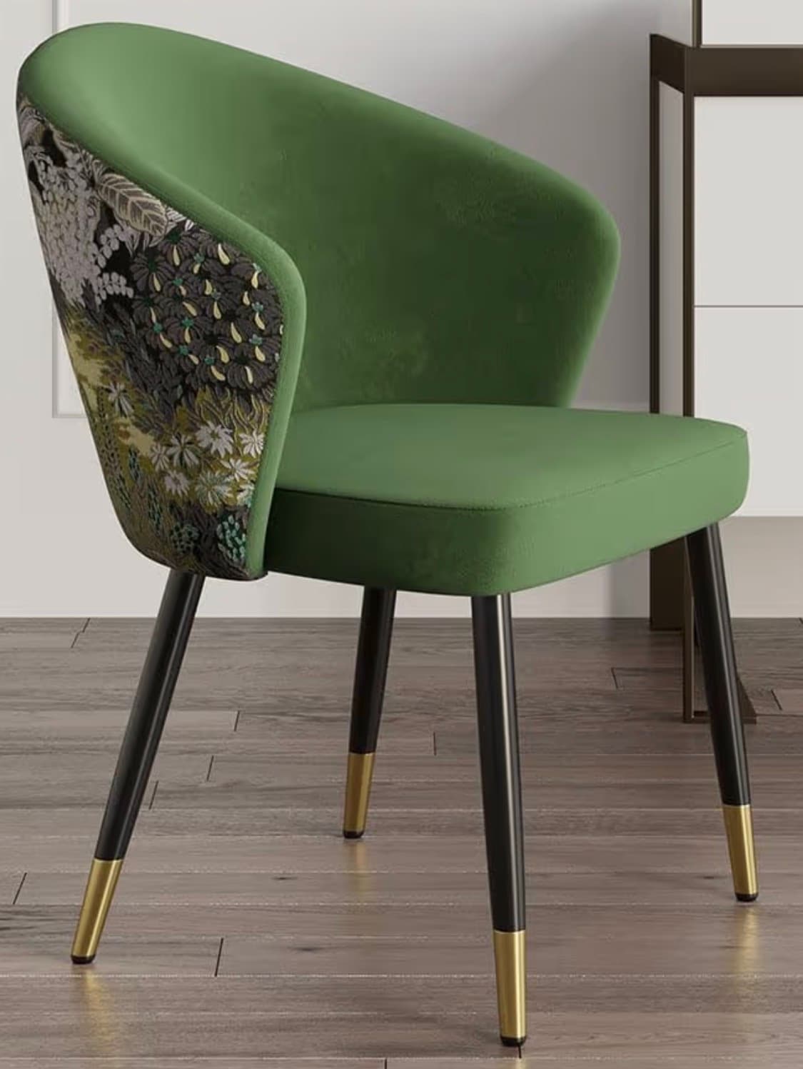 A contemporary armchair with a curved back and seat, upholstered in a textured green fabric. The sides of the backrest feature an intricate, detailed floral and botanical pattern in muted tones of grey, green, yellow, and black. The chair is supported by four slender, tapered legs that are black with brass-colored caps at the base. — 3D model