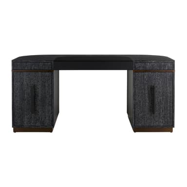 A modern executive desk with a dark, textured finish and curved pedestal bases. It features a rectangular top with a slight curve at the front and a recessed area near the back. The pedestal bases have metallic trim near the top and bottom, adding a decorative element. The overall design is contemporary and sleek. — 3D model