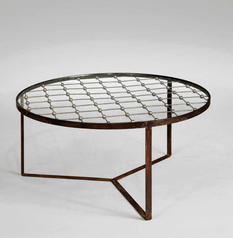 An oval coffee table with a glass top supported by a metal frame. The metal frame features a decorative pattern of intersecting rods with small spherical accents arranged in a grid-like fashion beneath the glass surface. The base consists of angular metal legs. — 3D model