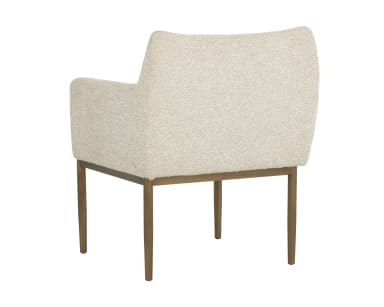 A contemporary armchair featuring a structured yet inviting design. It has a light-toned, textured boucle-like upholstery covering the seat, back, and armrests. The chair is supported by a slender metal frame with a warm, aged brass or bronze finish, which extends upwards to elegantly wrap around the outside of the upholstered armrests. The legs are straight and tapered, providing a clean, modern aesthetic. — 3D model