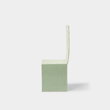 A minimalist chair with a high, straight back and a solid seat. The chair appears to be constructed from a moldable material, possibly resin or fiberglass, with a matte finish. It has a unique, almost monolithic form, with the seat and back merging seamlessly into the legs. A dark rod or dowel connects the two front legs, providing structural support. The overall aesthetic is simple and modern. — 3D model