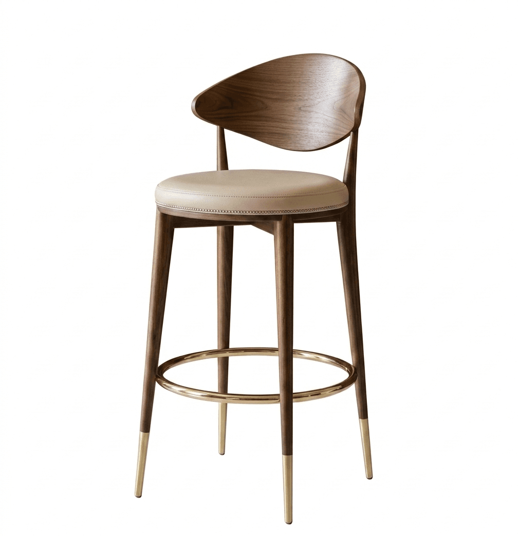 A contemporary bar stool featuring a curved wooden backrest, a padded seat upholstered in light-colored leather, and a wooden frame with four tapered legs. The legs are accented with brass ferrules at the base and a brass circular footrest connecting the front two legs. The seat is detailed with stitching around the perimeter. — 3D model