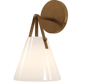 A modern wall sconce featuring a circular brass backplate, a short vertical arm, and a conical opal glass shade suspended by brass rods. The brass components have a brushed finish, while the glass shade provides a soft, diffused light. The design is minimalist and contemporary. — 3D model