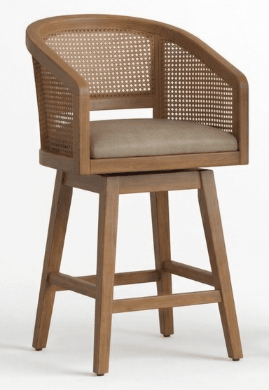 A wooden bar stool with a curved backrest and armrests featuring cane weaving. It has a padded seat and a swivel base supported by four legs connected by stretchers. The cane detailing on the back and sides provides a natural, airy aesthetic, while the wooden frame offers a sturdy structure. The seat appears to be upholstered in a neutral-toned material. — 3D model