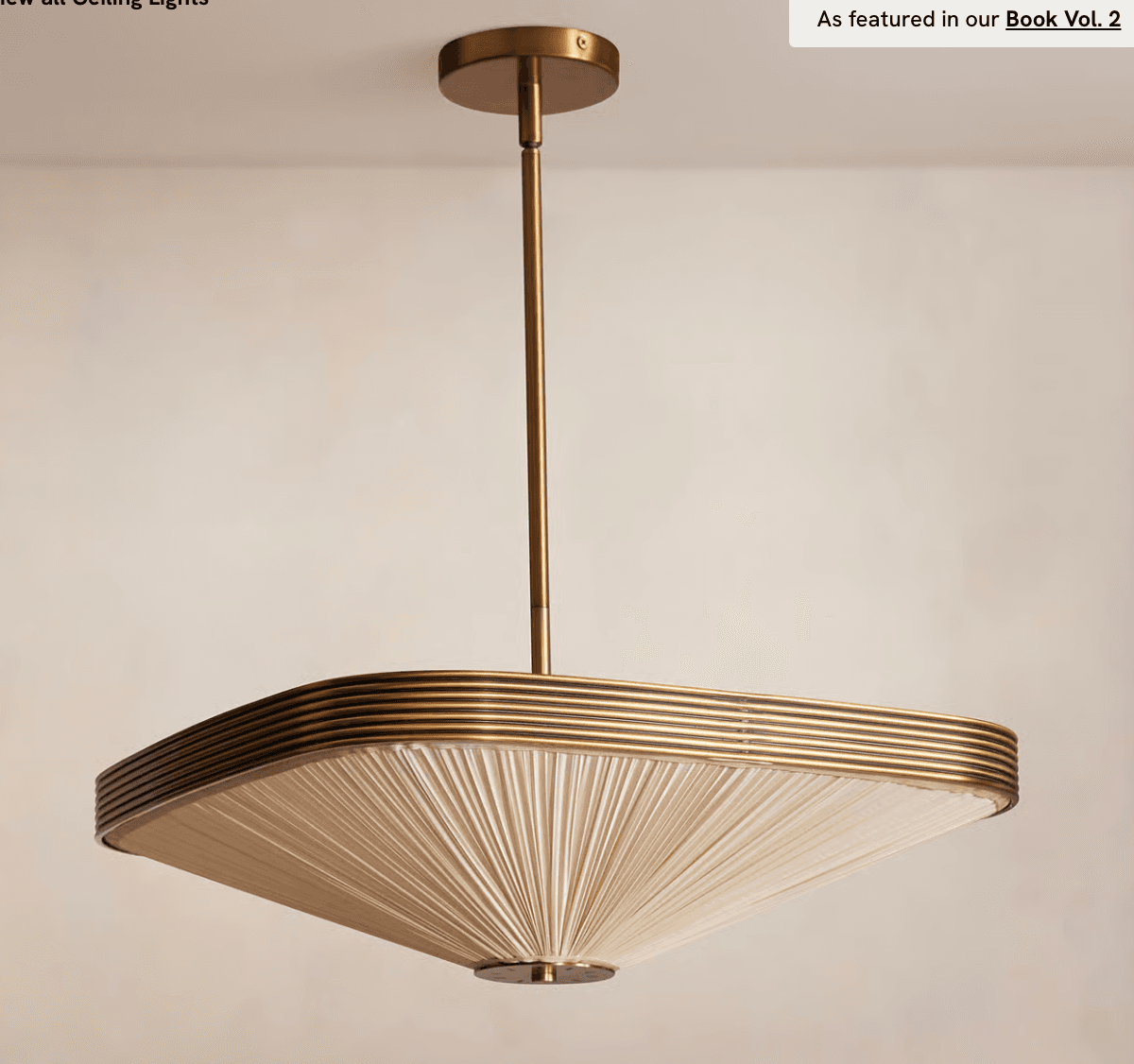 A square-shaped chandelier suspended from a central stem. The fixture features a decorative metal frame with concentric ribbed detailing around the top perimeter. The main body of the shade is composed of finely pleated fabric, creating a radiating effect from the center outwards. The mounting hardware and stem are made of a matching metal. — 3D model