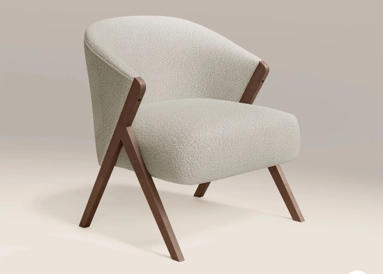 A contemporary upholstered armchair featuring a rounded backrest and seat, fully covered in a light, textured fabric. The chair is supported by a distinct exposed dark wood frame that forms both the splayed, tapered legs and the integrated armrest supports, creating an elegant and modern silhouette. — 3D model