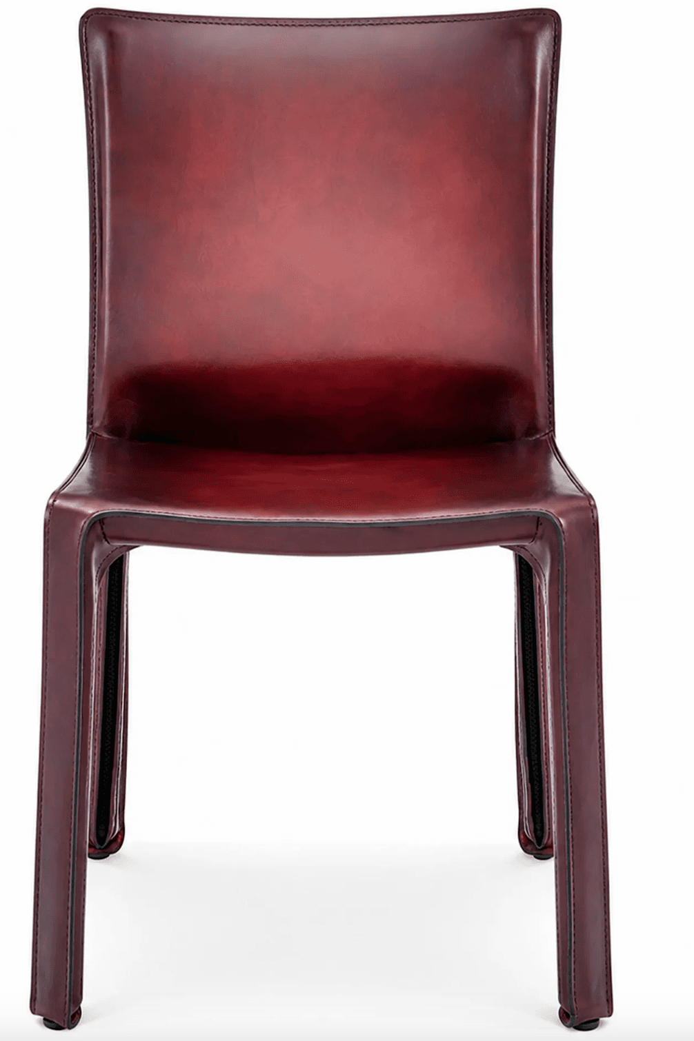 A modern dining chair fully upholstered in a deep reddish-brown leather. The chair features a high, gently curved backrest and a seat that flows seamlessly into the four tapered legs. Exposed contrast stitching outlines the edges of the leather panels, highlighting the chair's construction. The overall design is sleek and minimalist, emphasizing the material. — 3D model