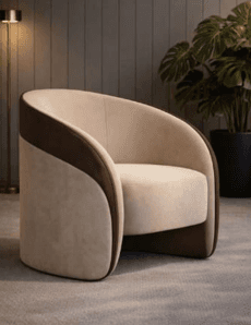 A modern upholstered armchair featuring a distinctive barrel-shaped silhouette. The chair is upholstered in two contrasting fabrics: a light beige for the interior seat and back, and a darker brown for the exterior sides and back. It has a plush, thick seat cushion and a continuous, rounded form that integrates the armrests and backrest seamlessly. The design suggests a low-profile or concealed base. — 3D model