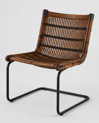 A modern armless chair featuring a woven rattan seat and backrest on a black powder-coated steel cantilever frame. — 3D model