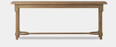 A long, narrow wooden console table with a rectangular top surface. It features four straight, block-style legs connected by a horizontal stretcher bar along the bottom. Distinctive curved, semi-circular wooden supports are integrated into the stretcher bar near the base of each leg. The wood exhibits a light, natural, or distressed finish. — 3D model