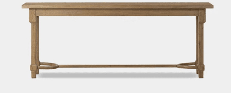A long, narrow wooden console table with a rectangular top surface. It features four straight, block-style legs connected by a horizontal stretcher bar along the bottom. Distinctive curved, semi-circular wooden supports are integrated into the stretcher bar near the base of each leg. The wood exhibits a light, natural, or distressed finish. — 3D model