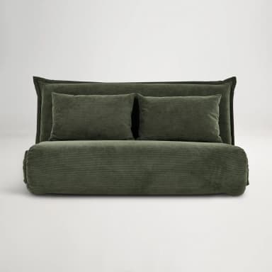 A convertible sofa bed upholstered in dark green corduroy fabric. The piece features a low profile with a rolled armrest/base and a fold-out mattress configuration. It includes two rectangular throw pillows that match the upholstery. — 3D model