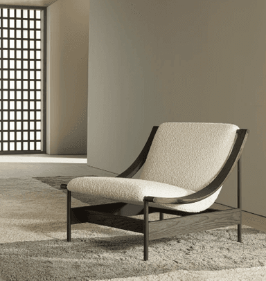 A modern lounge chair featuring a dark-stained solid wood frame and plush, off-white bouclé fabric upholstery. The design emphasizes clean lines and natural textures, with a low profile for relaxed seating. — 3D model