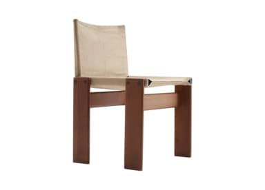 A low-profile lounge chair featuring a sturdy, rectilinear wooden frame and a minimalist sling construction for the seat and backrest, crafted from tan-colored leather. The frame appears to be made from a warm-toned hardwood, possibly teak or walnut, with visible joinery or bolted connections. The leather components are thick, showing stitched seams, providing a relaxed and modern aesthetic. The chair is designed for comfort with an emphasis on natural materials and clean lines. — 3D model