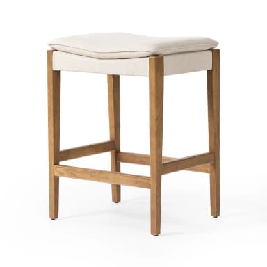 A contemporary upholstered wooden bar stool featuring a sturdy, light-toned solid wood frame and a comfortable, off-white fabric saddle-style seat. The stool includes integrated footrests and clean lines, designed for counter-height seating. — 3D model