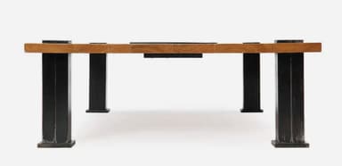 A rectangular coffee table featuring a light-toned wooden top with a central, recessed black inlay. The table is supported by four robust, square-sectioned black metal legs, which are visibly attached to the tabletop with square black metal corner brackets. — 3D model