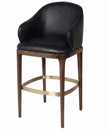 A contemporary bar stool featuring a plush black leather upholstered seat and back with integrated armrests. It is supported by a dark wood frame with four tapered legs, and includes a circular brass-toned metal footrest. — 3D model