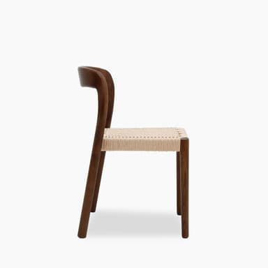 A wooden dining chair with a woven seat. The chair features a solid wood frame with gently curved backrest and legs. The seat is constructed from tightly woven natural fiber ropes or cords, providing a textured surface. — 3D model