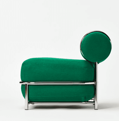 A modernist lounge chair featuring a bright emerald green upholstered seat and cylindrical bolster backrest, supported by a polished tubular chrome frame. The design is sleek and features minimalist lines. — 3D model