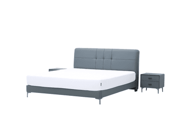 A modern upholstered platform bed featuring a rectangular headboard with grid-patterned panel tufting. The bed frame is also upholstered, and both the bed and the two matching nightstands are supported by slim, tapered metal legs. The nightstands each have two drawers with minimalist pulls. A white mattress is visible on the bed frame. — 3D model