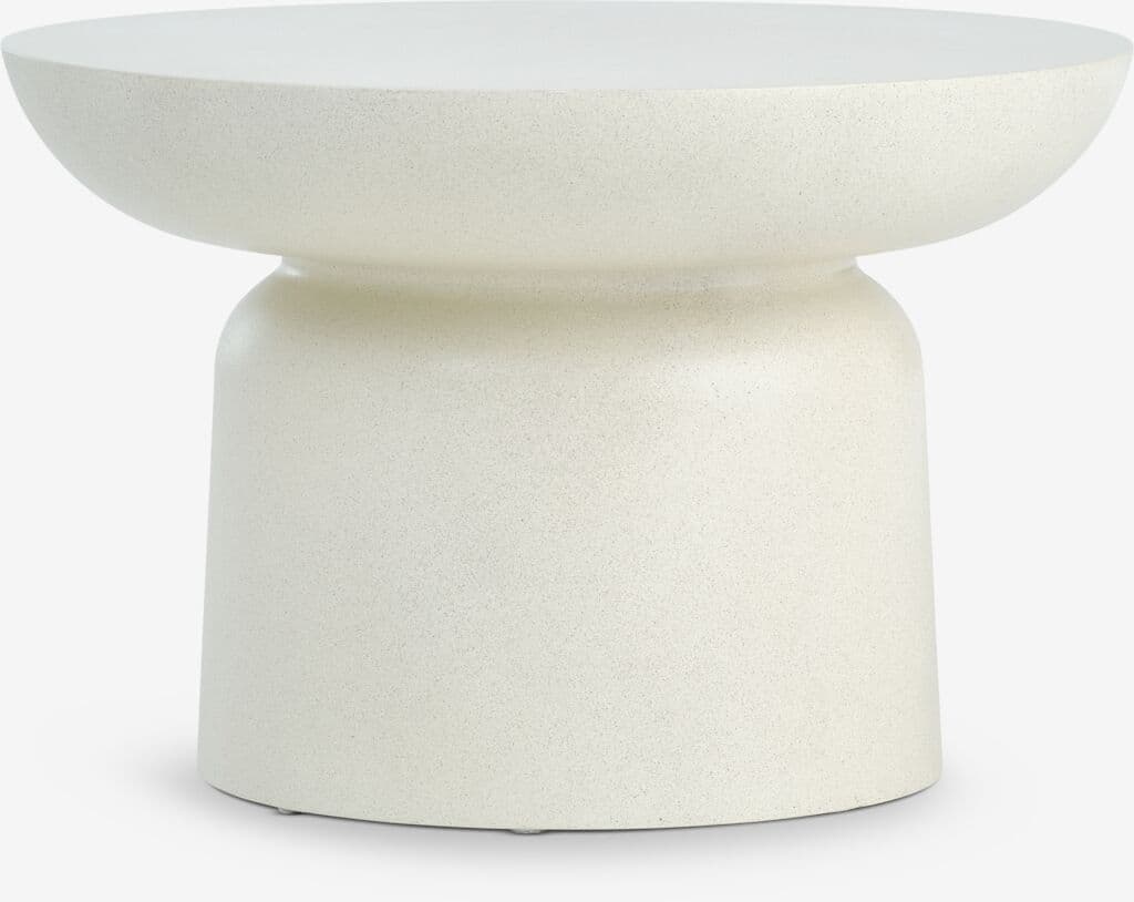 A small, off-white side table with a distinct two-part form: a wide, shallow, dish-like top and a solid, cylindrical base, connected by a subtle, recessed neck. The surface appears to be a textured, matte finish, possibly concrete or a similar composite material. — 3D model