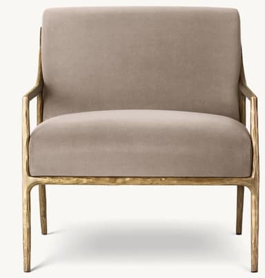 A modern armchair with a distinctive sculptural frame. The chair features a padded seat and backrest upholstered in a neutral fabric, supported by an open, organic-shaped frame that extends to form the legs and armrests. The frame has a textured, metallic finish. — 3D model