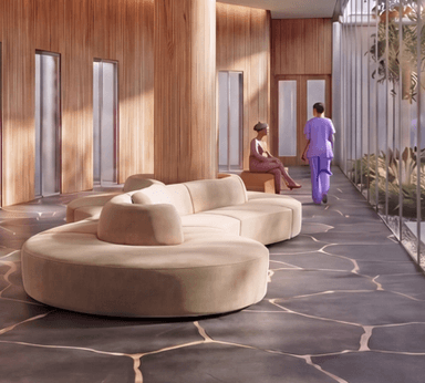 A modular, curved sofa with a rounded, semi-circular overall shape. It is composed of multiple connected sections, forming a continuous seating arrangement. The sofa features low-profile backrests and a cohesive, upholstered design. The central section has a distinctive curved backrest that flows into the main body of the sofa. — 3D model