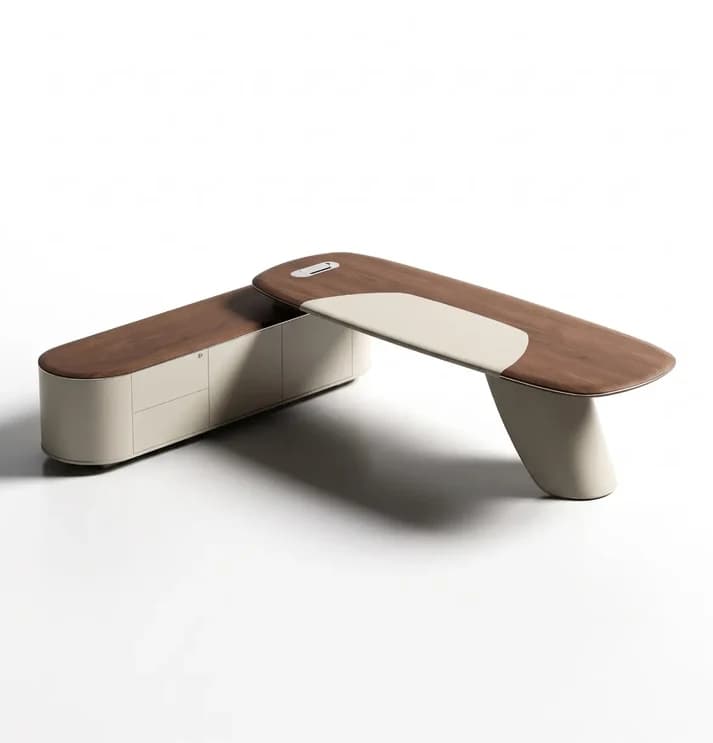 A modern executive desk featuring an elongated, asymmetrical wooden top with an integrated light-colored leather writing pad, supported by a curved pedestal leg and an attached low credenza with storage compartments. — 3D model