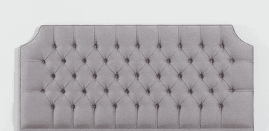 A light blue upholstered headboard with a tufted design. The tufting creates a diamond pattern with buttons at each intersection. The headboard has a slightly arched top and is mounted on a base that is not fully visible. — 3D model