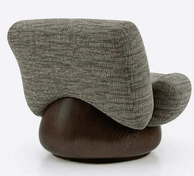 A comfortable armchair with rounded arms and a high back, upholstered in a textured fabric. The chair rests on a circular, dark wooden base that appears to be a swivel mechanism. — 3D model