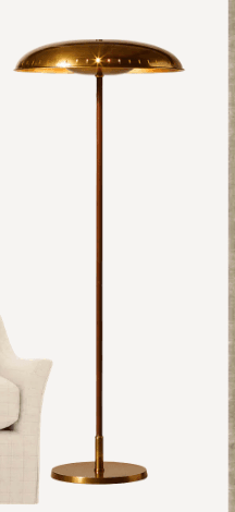 A floor lamp featuring a polished brass dome shade, a slender, darker cylindrical shaft, and a circular brass base. The shade has small perforations along its rim. — 3D model