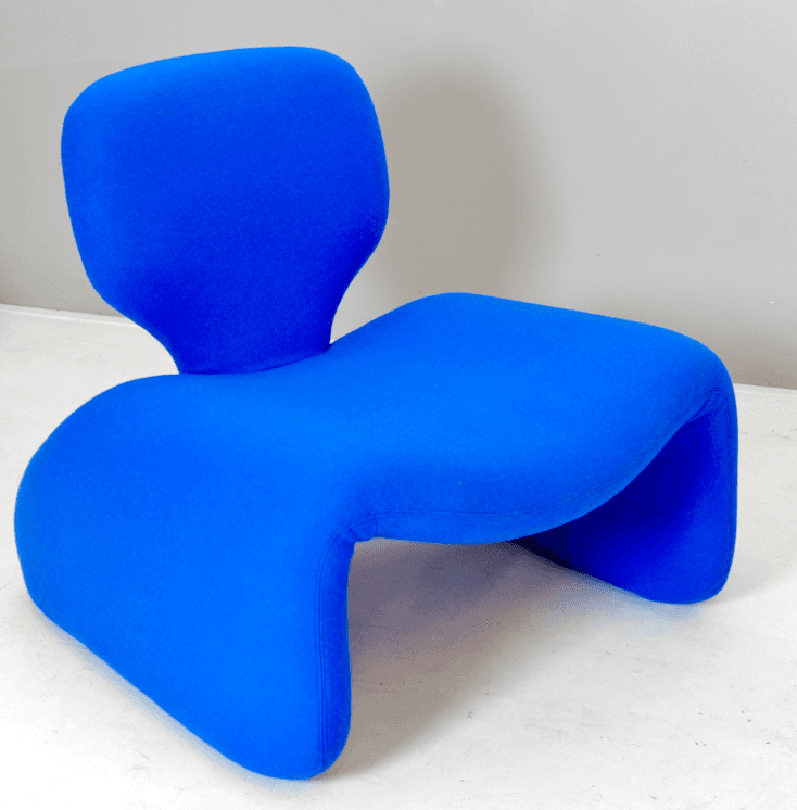 An armless lounge chair featuring a distinctive organic and sculptural form, entirely upholstered in a vibrant blue textured fabric. The chair's design is characterized by its continuous, fluid lines that seamlessly integrate the seat, backrest, and base, creating a modern and comfortable seating experience. — 3D model
