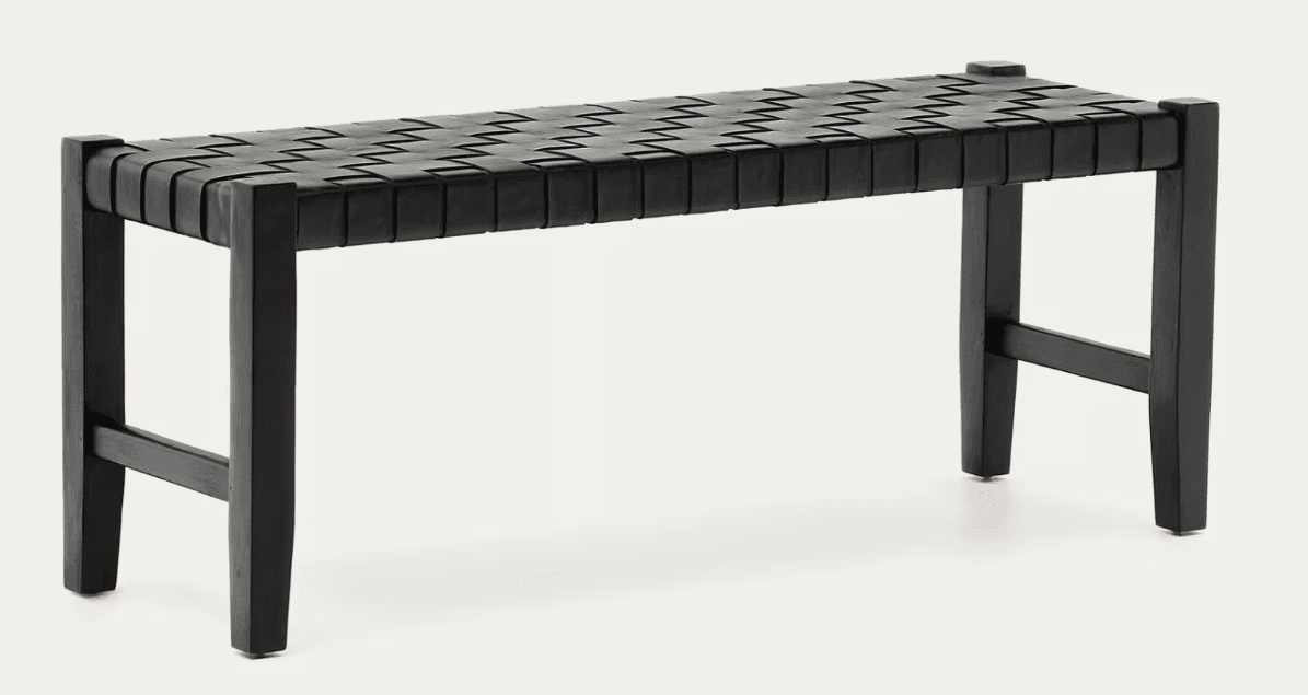 A black woven bench with a rectangular seat and four straight legs. The seat is constructed from horizontal and diagonal woven straps, creating a chevron pattern. The frame and legs appear to be made of wood. — 3D model