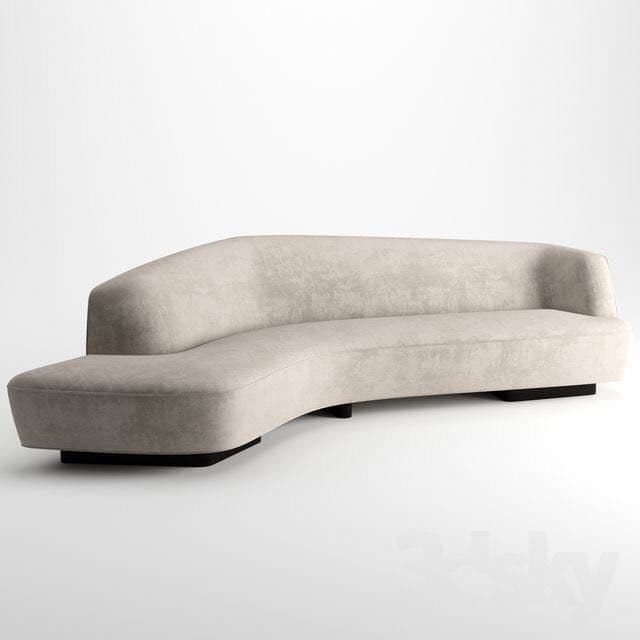 A contemporary curved sofa with a low profile and a single, continuous seating surface. The sofa features a sinuous, organic shape with rounded edges and a prominent chaise-like extension on one side. It is supported by a set of discreet, dark-colored block feet. — 3D model