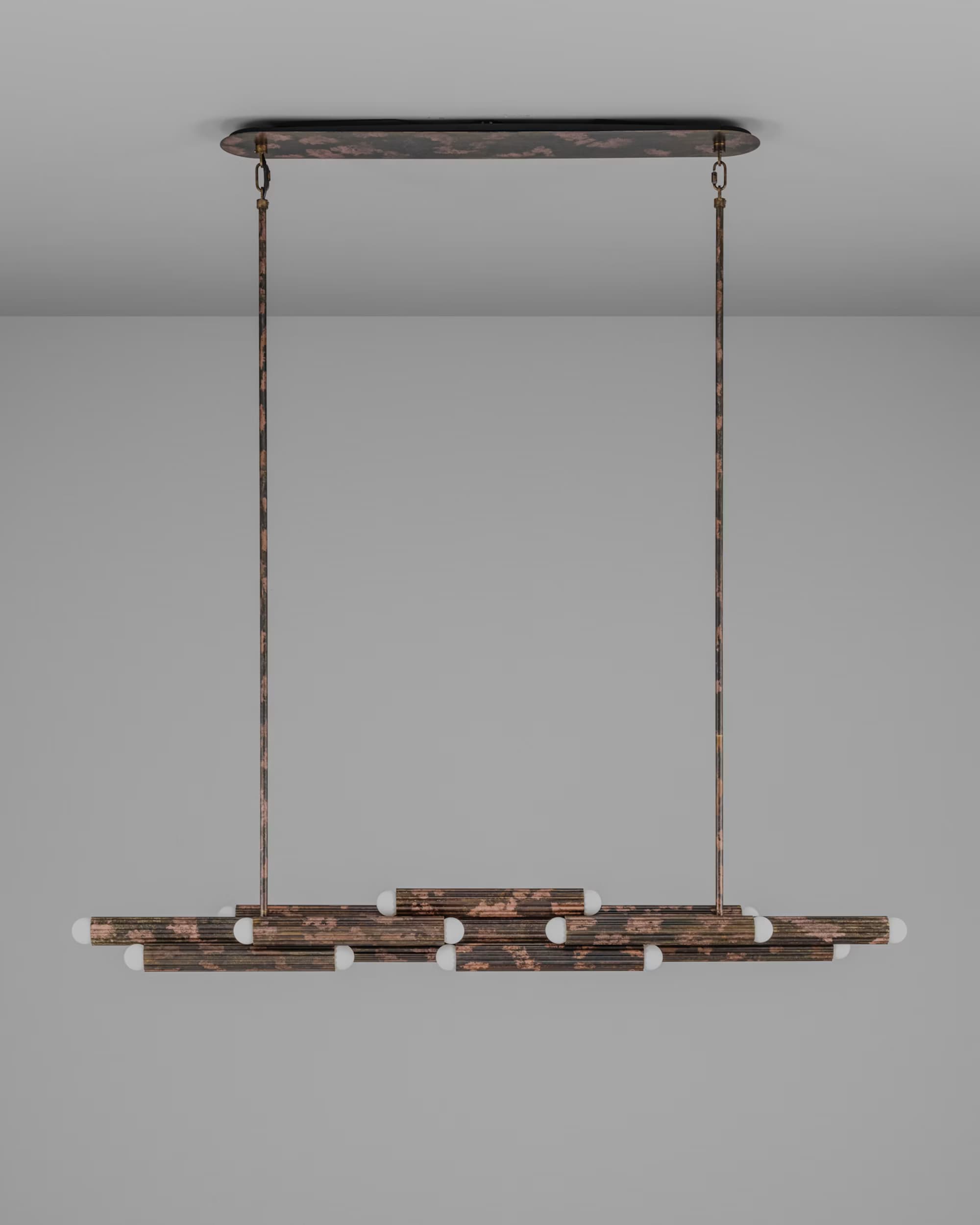 A contemporary linear chandelier featuring a distressed metal finish. The fixture is suspended from the ceiling by two rigid rods connected to an oval canopy. The main body consists of multiple horizontal metal bars, arranged in a layered, somewhat staggered configuration. Small, spherical light bulbs are integrated along the lengths of these bars, providing multi-directional illumination. The metal has a variegated, textured patina, appearing dark with reddish-brown, copper-like accents, suggesting an aged or industrial aesthetic. The design is sleek and minimalist, with exposed light sources. — 3D model