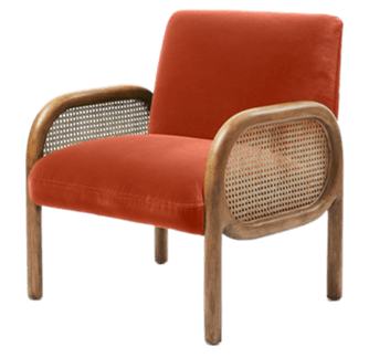 An armchair featuring a solid wood frame with distinct curved lines, woven cane panels on the sides, and plush velvet upholstery for the seat and back cushions. The design evokes a mid-century modern aesthetic. — 3D model