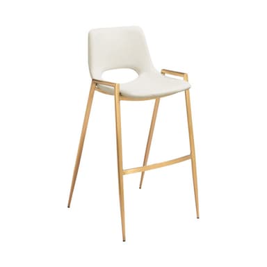 A contemporary bar stool featuring a subtly molded seat and backrest upholstered in an off-white or cream faux leather. The seat has a slight curvature for ergonomic comfort. It is supported by four slender, tapered metal legs in a gold or brass finish, connected by an integrated rectangular footrest for stability. The overall design is sleek and modern. — 3D model