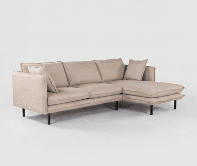A modern sectional sofa with an integrated chaise lounge, upholstered in a light beige textured fabric, supported by slender black metal legs. — 3D model