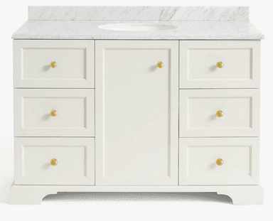 A white painted bathroom vanity featuring a white marble countertop with an integrated oval sink. The vanity cabinet has a central door and six drawers, three on each side, all adorned with small brass knobs. The cabinetry features recessed panel fronts, and the base has a simple decorative cut-out. — 3D model