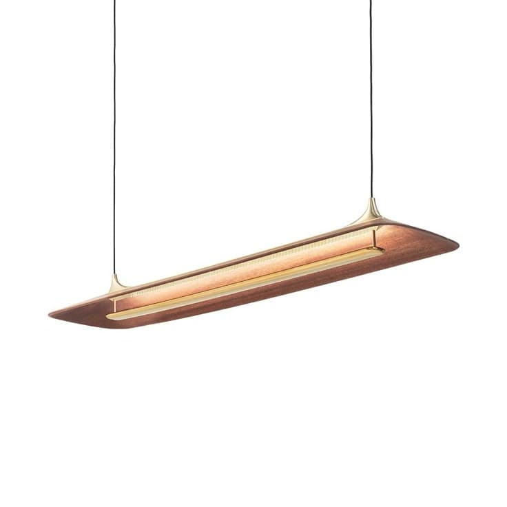 A contemporary pendant light fixture with a long, rectangular, flattened shape. It features a wooden body with a brass metal frame and accents. The light source appears to be an integrated LED strip positioned within a channel, emitting a warm glow. — 3D model