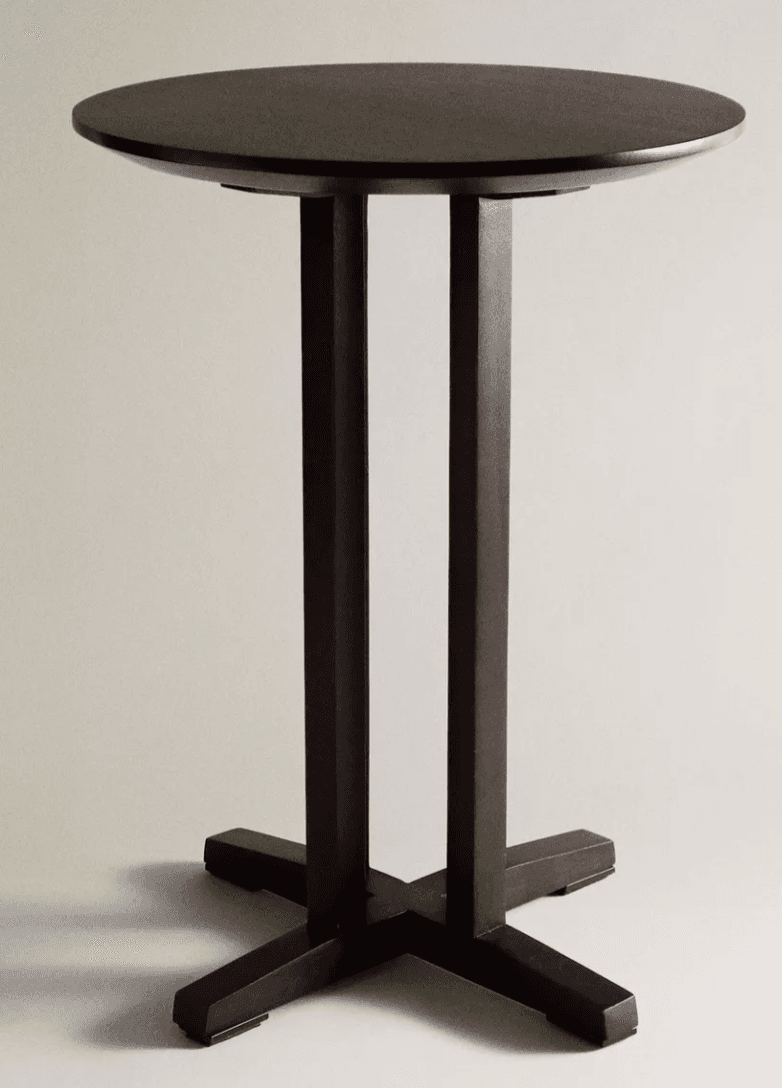 A dark brown, round bar-height table featuring a unique twin-pedestal base that converges into a stable X-shaped foot. The tabletop has a subtly beveled edge. — 3D model