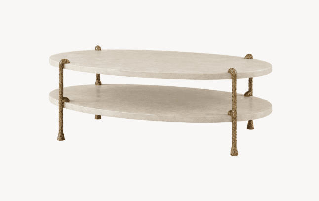 A two-tiered oval coffee table with a textured, light-colored surface and ornate metallic legs. The table features two distinct oval-shaped surfaces, one positioned above the other. The legs are slender and appear to be made of metal with an antique brass or bronze finish, exhibiting a textured, almost organic design. — 3D model